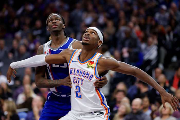 Nov 10, 2023; Sacramento, California, USA; Oklahoma City Thunder guard Shai Gilgeous-Alexander (2) is guarded by Sacramento Kings guard Keon Ellis (23) during the fourth quarter at Golden 1 Center.